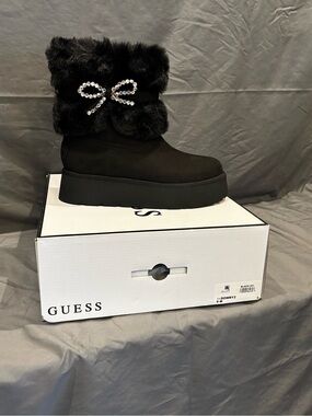 GUESS Black Faux Fur Platform Boot with Crystal Bow Accent
